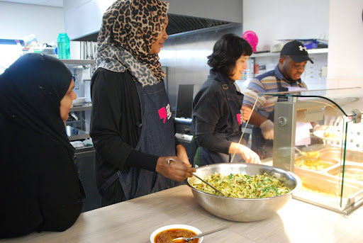 Volunteers at Govan Community Project serving meal