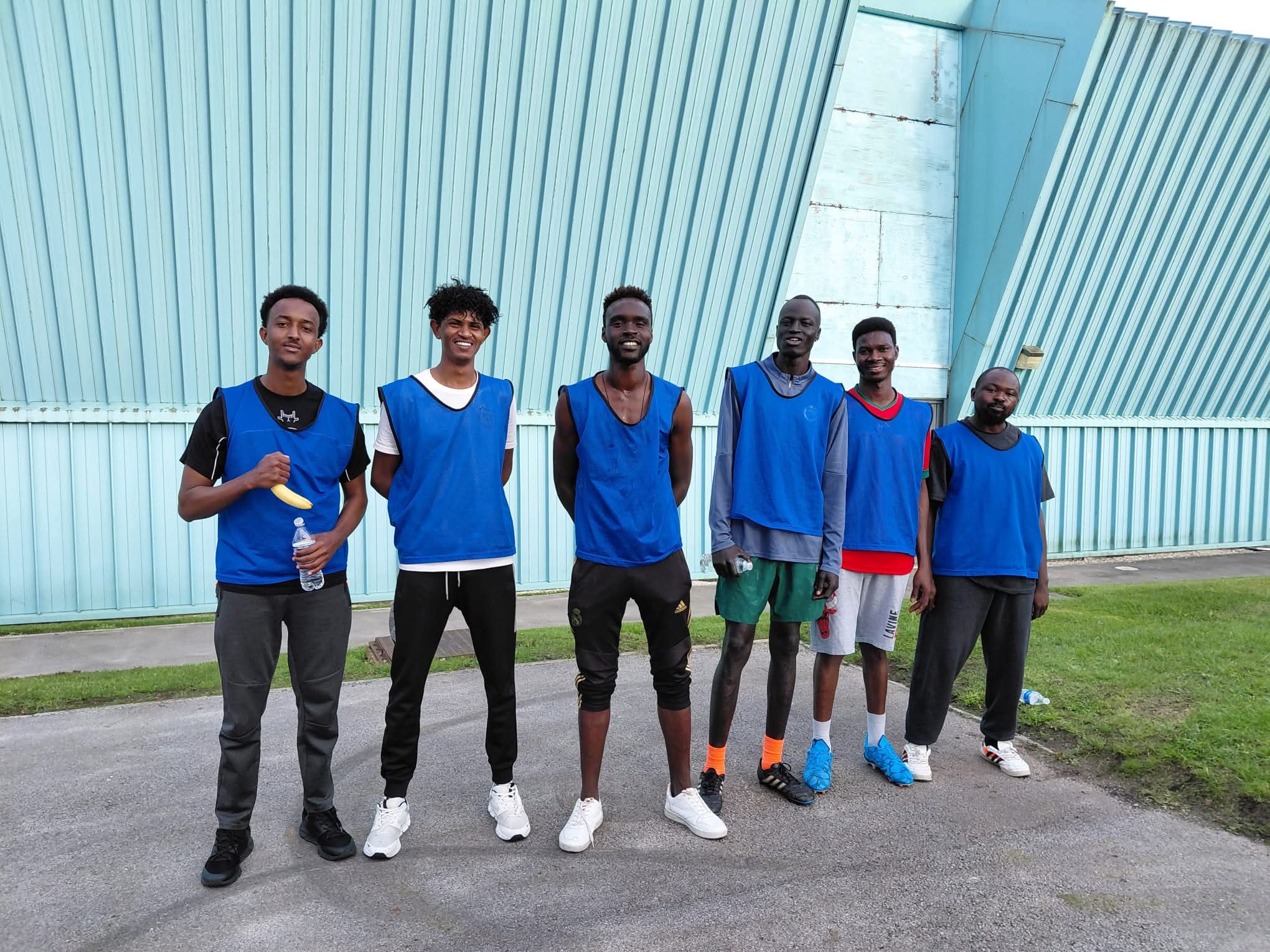 Group photo of service users from Greater Together Manchester ready to play football.